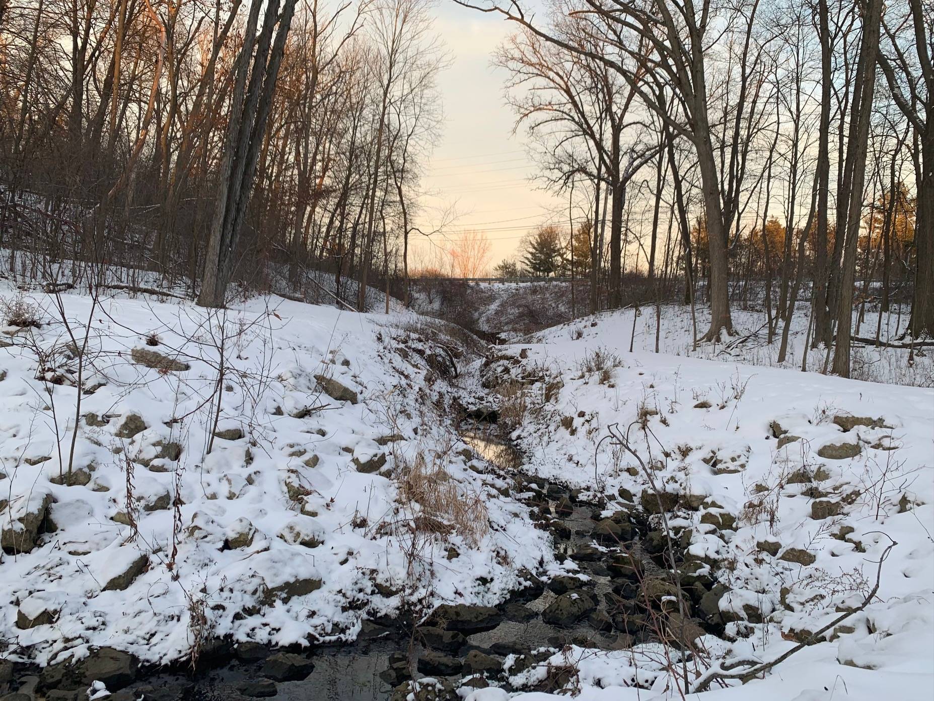 A drainage creek connects Church Lake to a nearby roadway, potentially delivering road salt applied during the winter.